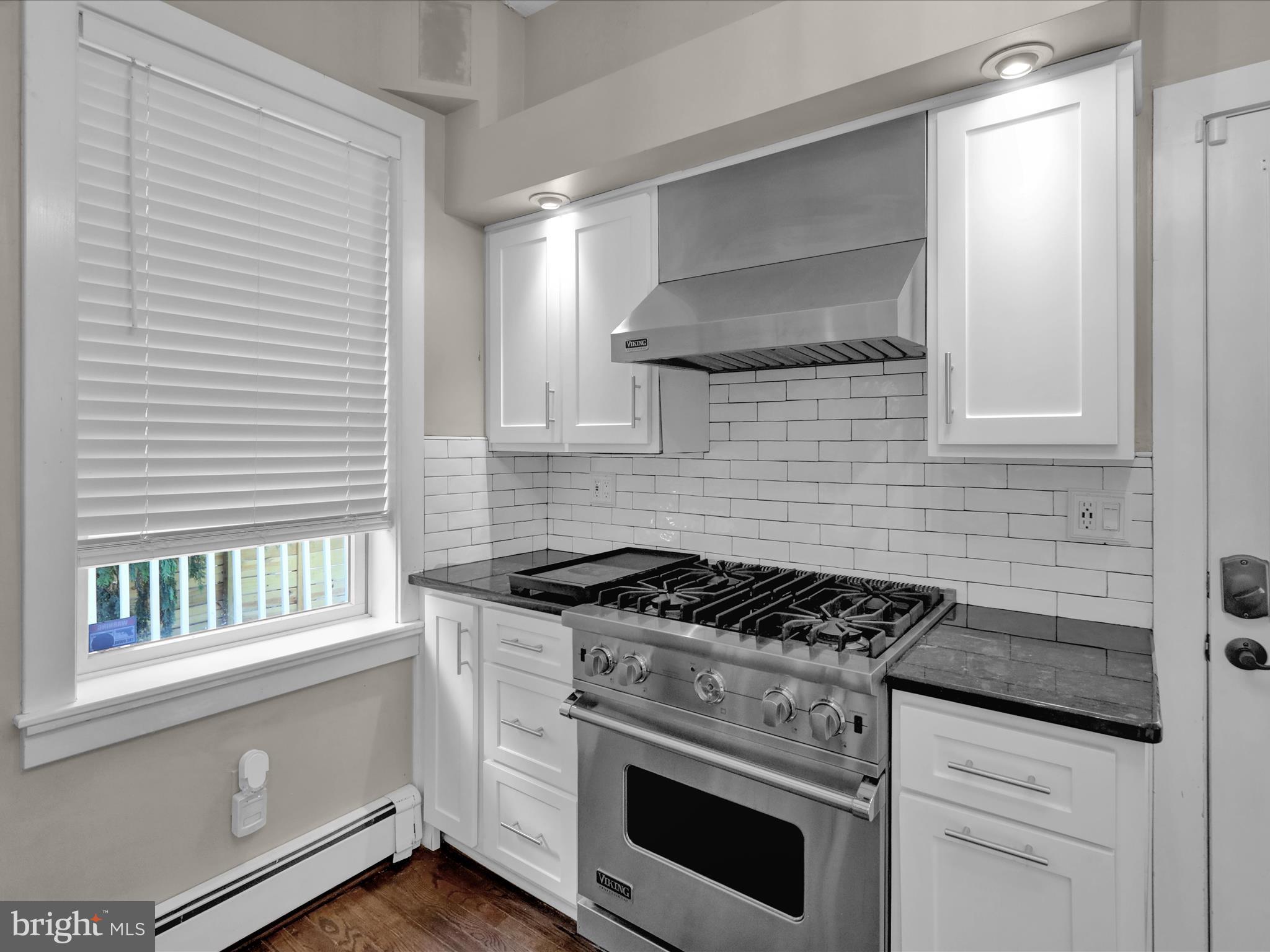 1315 Cleveland Avenue Wyomissing, PA 19610 - Photo 12 of 43 a kitchen with white cabinets and appliances