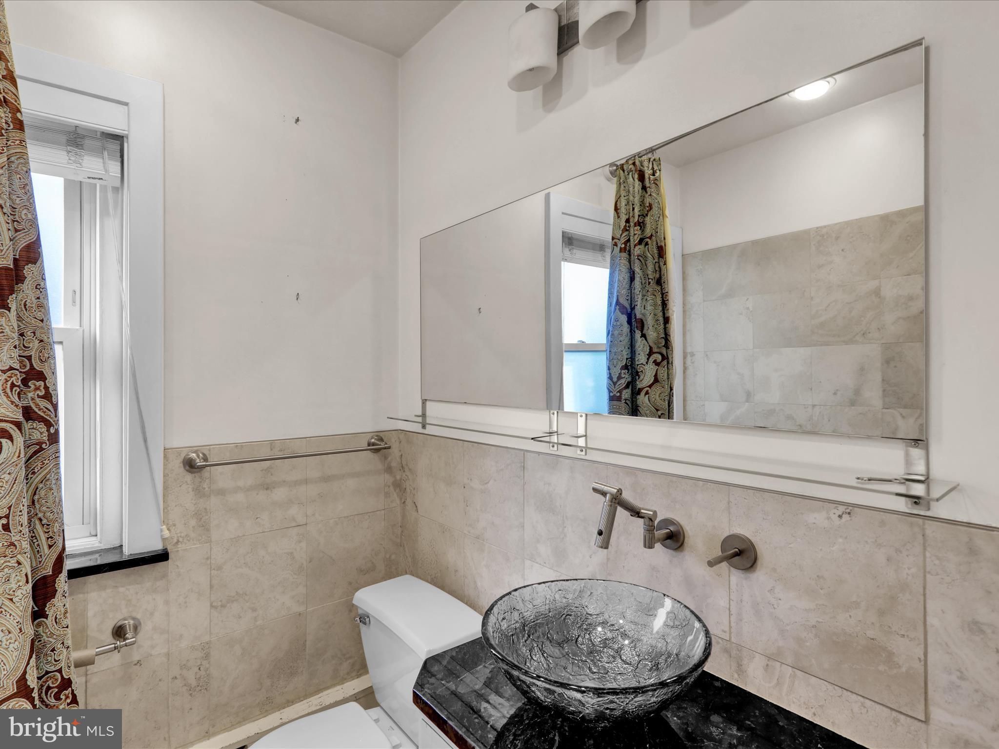 1315 Cleveland Avenue Wyomissing, PA 19610 - Photo 20 of 43 a bathroom with a sink and a mirror