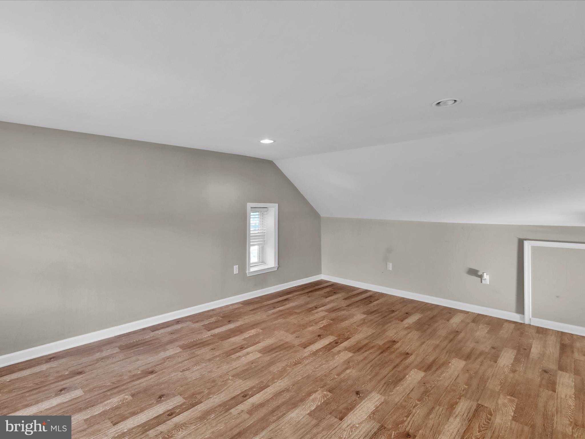 1315 Cleveland Avenue Wyomissing, PA 19610 - Photo 25 of 43 a view of an empty room with wooden floor and a window