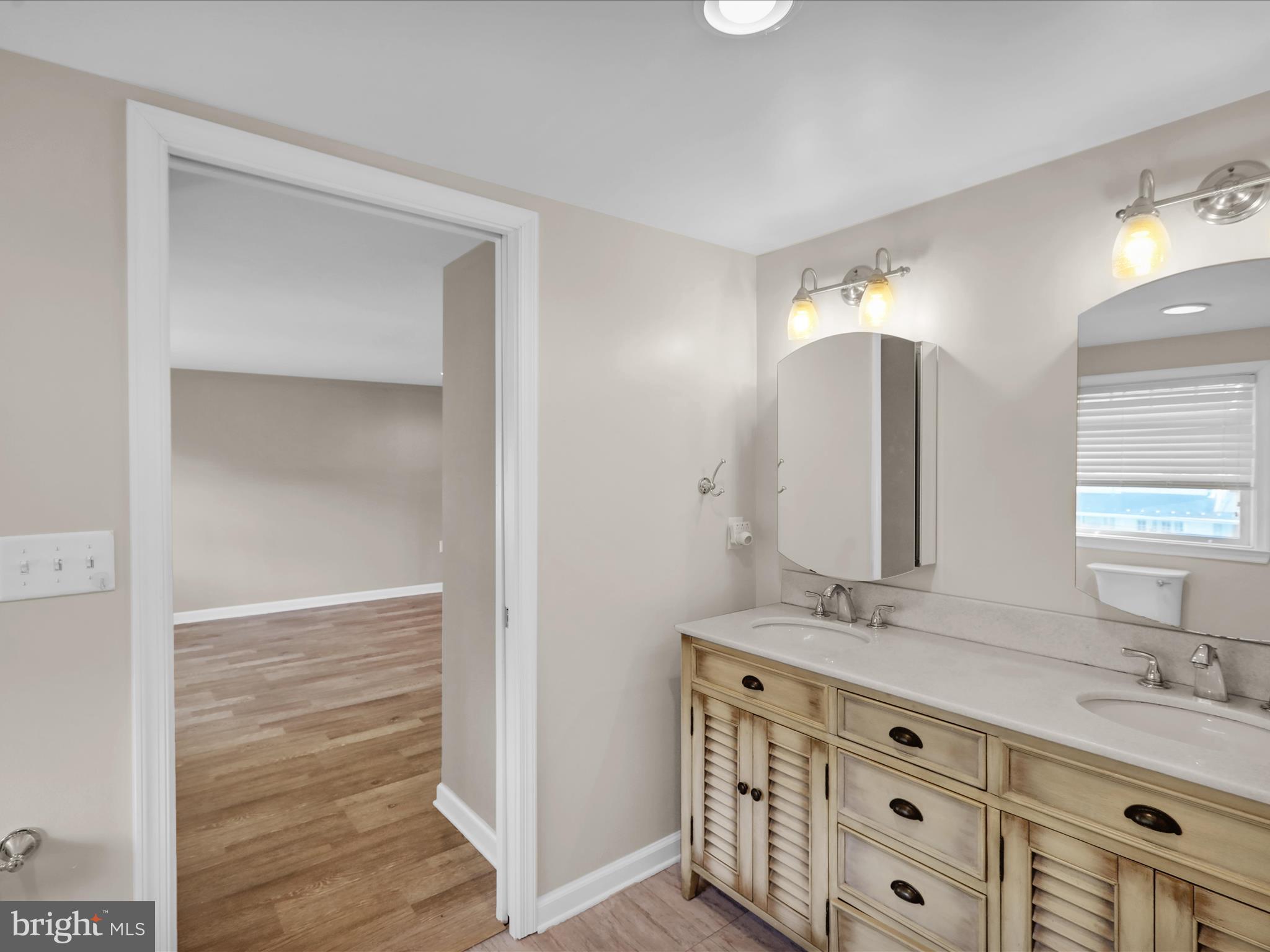 1315 Cleveland Avenue Wyomissing, PA 19610 - Photo 26 of 43 a bathroom with a double vanity sink and a mirror