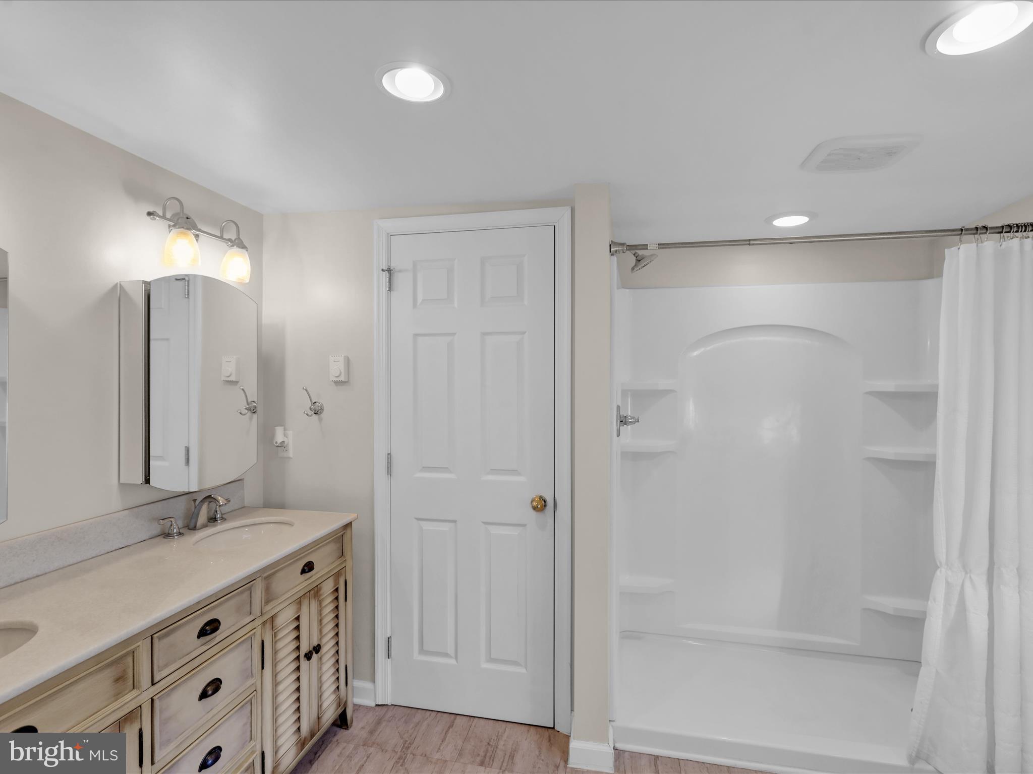 1315 Cleveland Avenue Wyomissing, PA 19610 - Photo 27 of 43 a bathroom with a double vanity sink mirror and shower