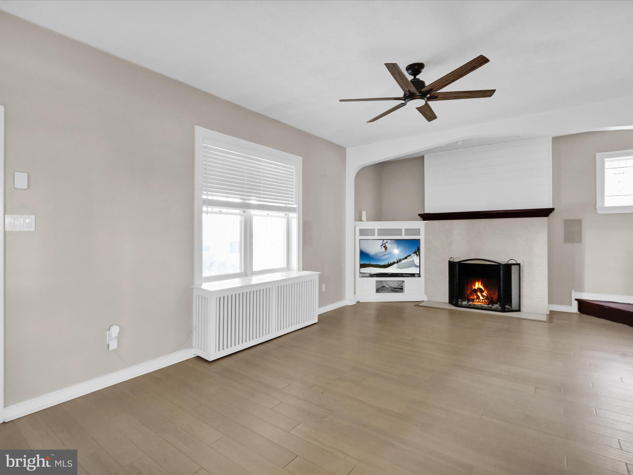 1315 Cleveland Avenue Wyomissing, PA 19610 - Photo 3 of 43 a view of a livingroom with a fireplace a ceiling fan and fireplace