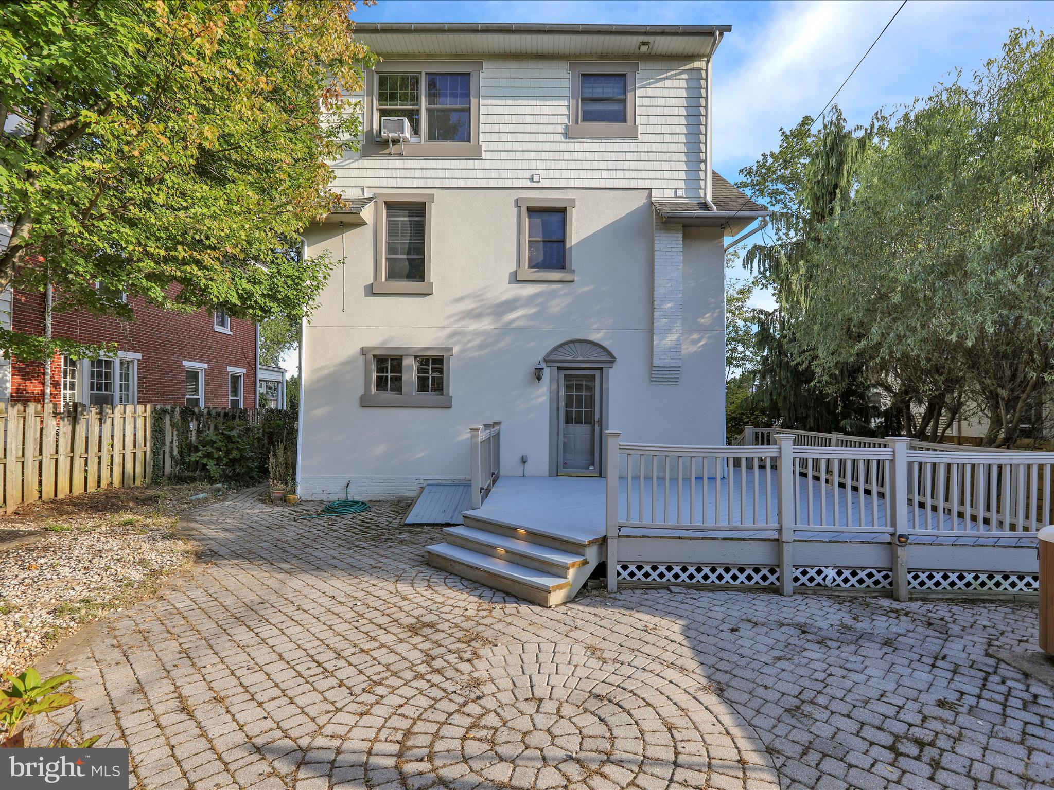 1315 Cleveland Avenue Wyomissing, PA 19610 - Photo 38 of 43 a view of a white house with a small yard and wooden fence