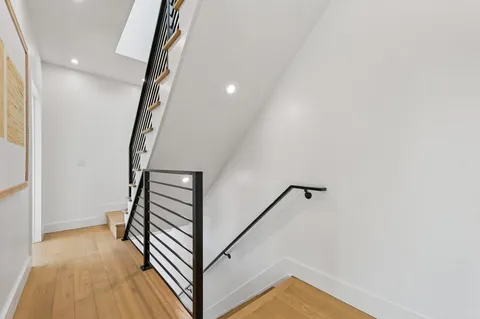 a view of a hallway with staircase