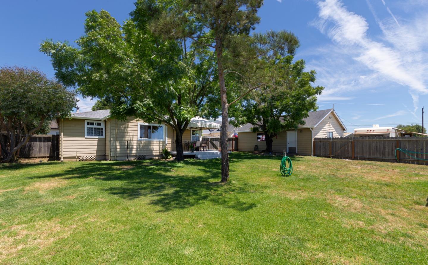 11 Heiner Road Watsonville, CA 95076 - Photo 19 of 21 a brick house with a big yard and large trees
