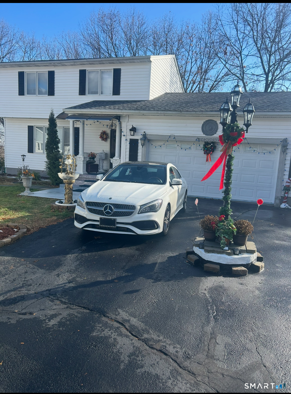 135 Pheasant Road West Haven, CT 06516 - Photo 1 of 23 a car parked in front of a white house