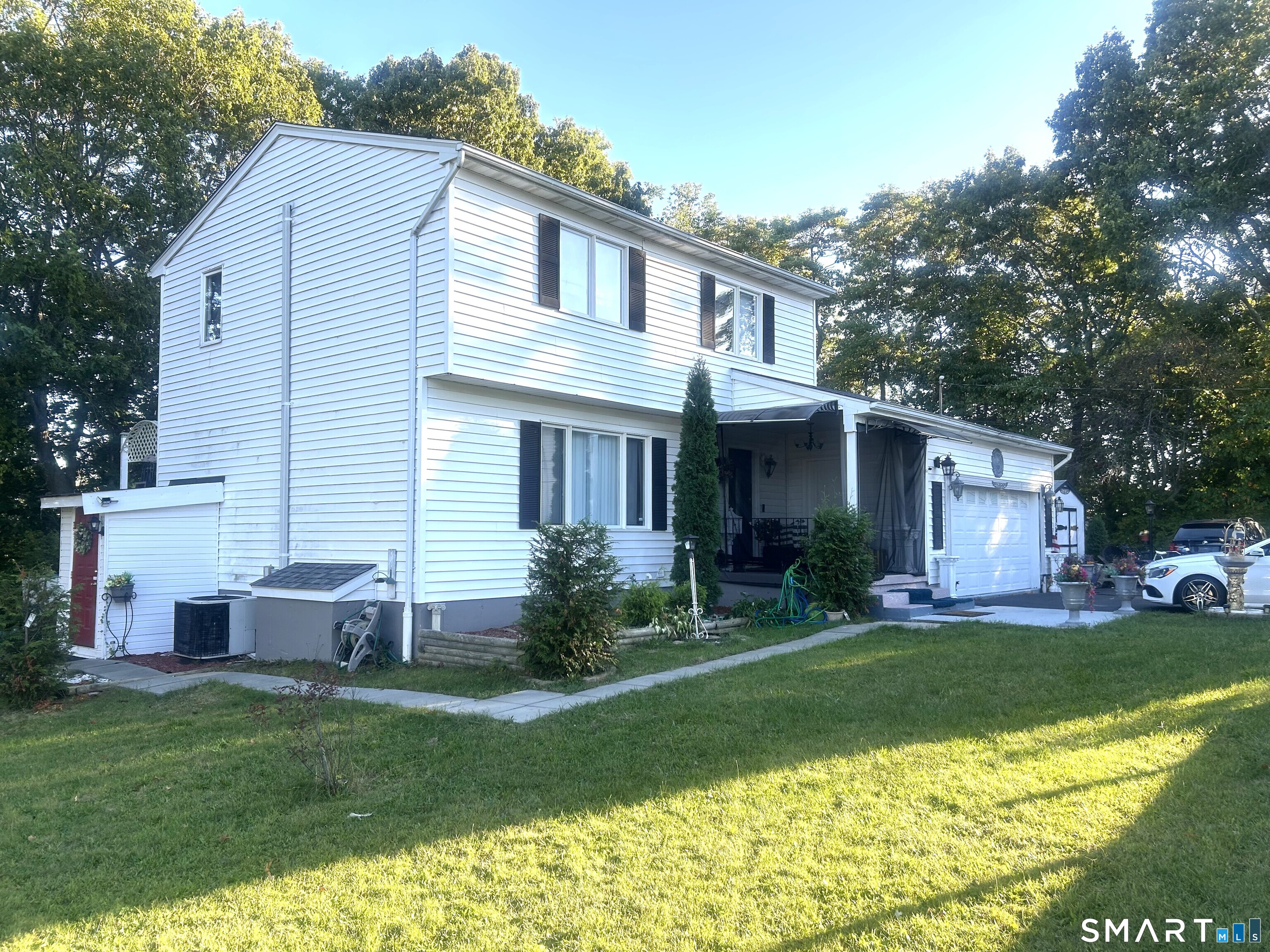 135 Pheasant Road West Haven, CT 06516 - Photo 2 of 23 a front view of house with yard and green space