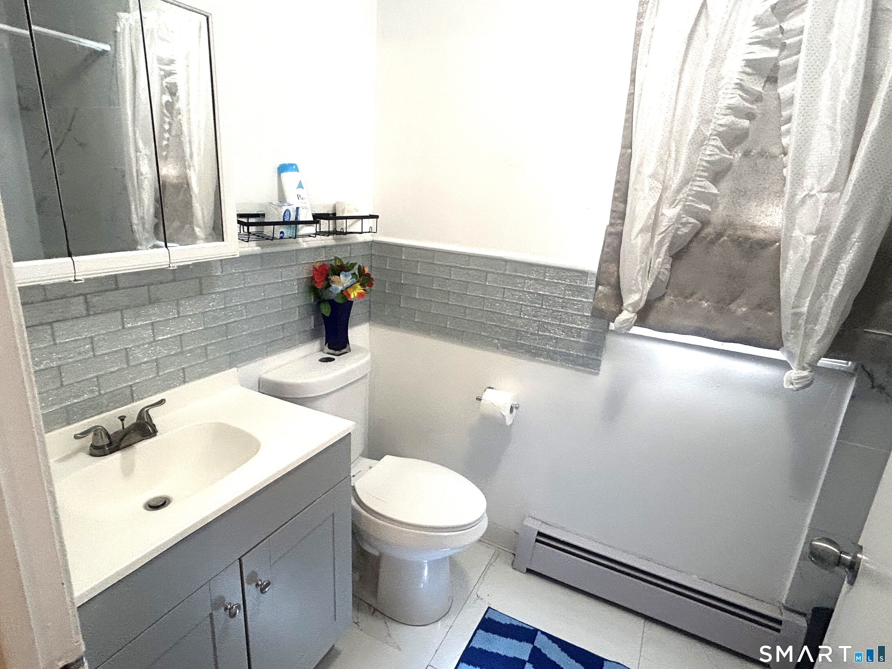 135 Pheasant Road West Haven, CT 06516 - Photo 23 of 23 a bathroom with a sink mirror and toilet
