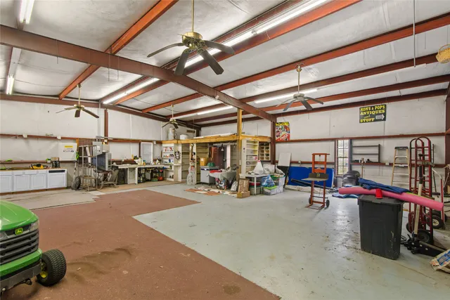 a yellow room with pool table and a furniture