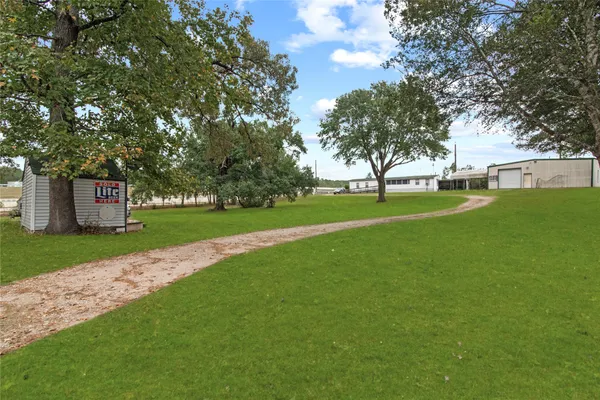 a view of yard with tree s