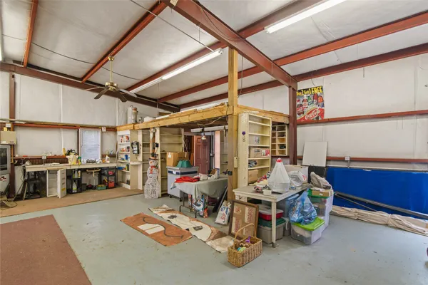 a view of a backyard with large tree and deck