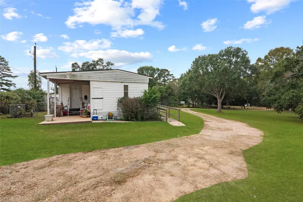 a view of a house with a big yard