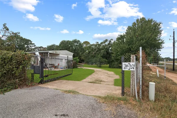a front view of a house with a big yard