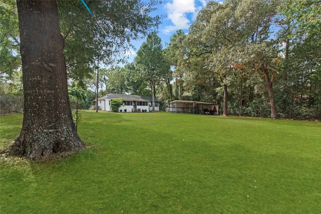 a house view with a sitting space and garden