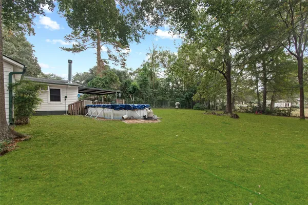 a view of backyard with green space
