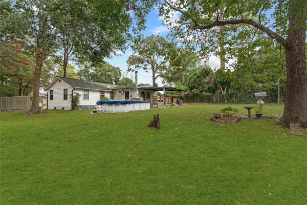 a view of a house with a yard porch and sitting area
