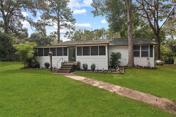 a sitting area with furniture and wooden deck