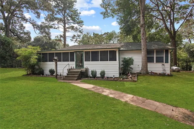a sitting area with furniture and wooden deck