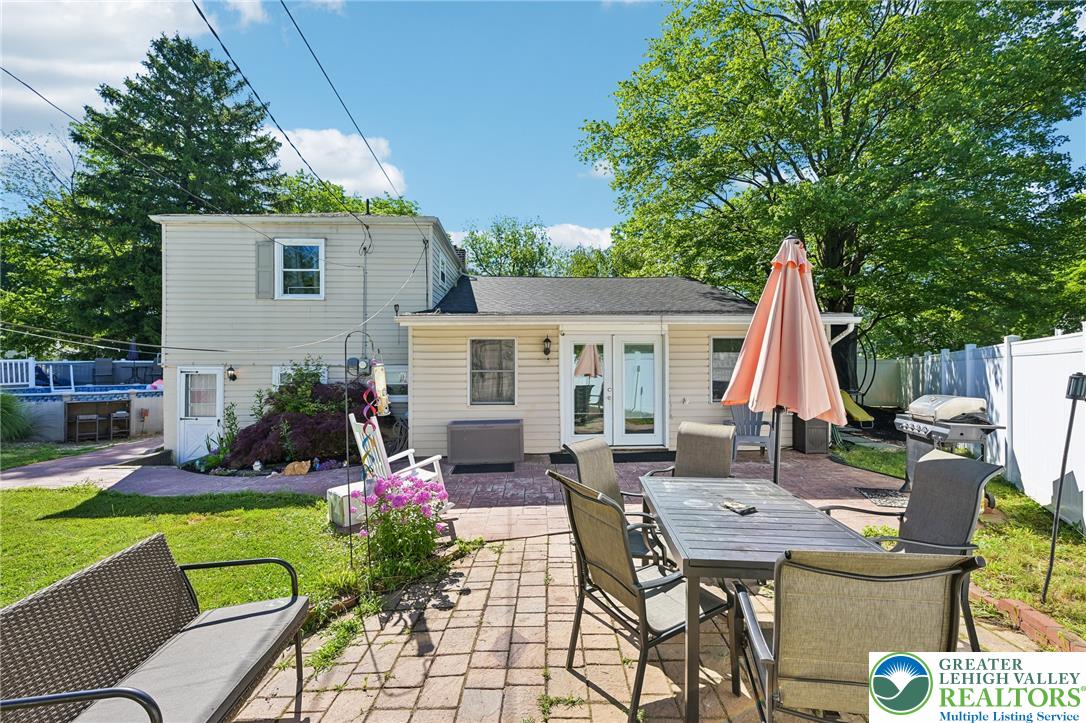 2649 Nottingham Road Bethlehem, PA 18017 - Photo 35 of 49 An inviting paver patio extends from the home's rear, offering ample space for outdoor dining and entertaining.