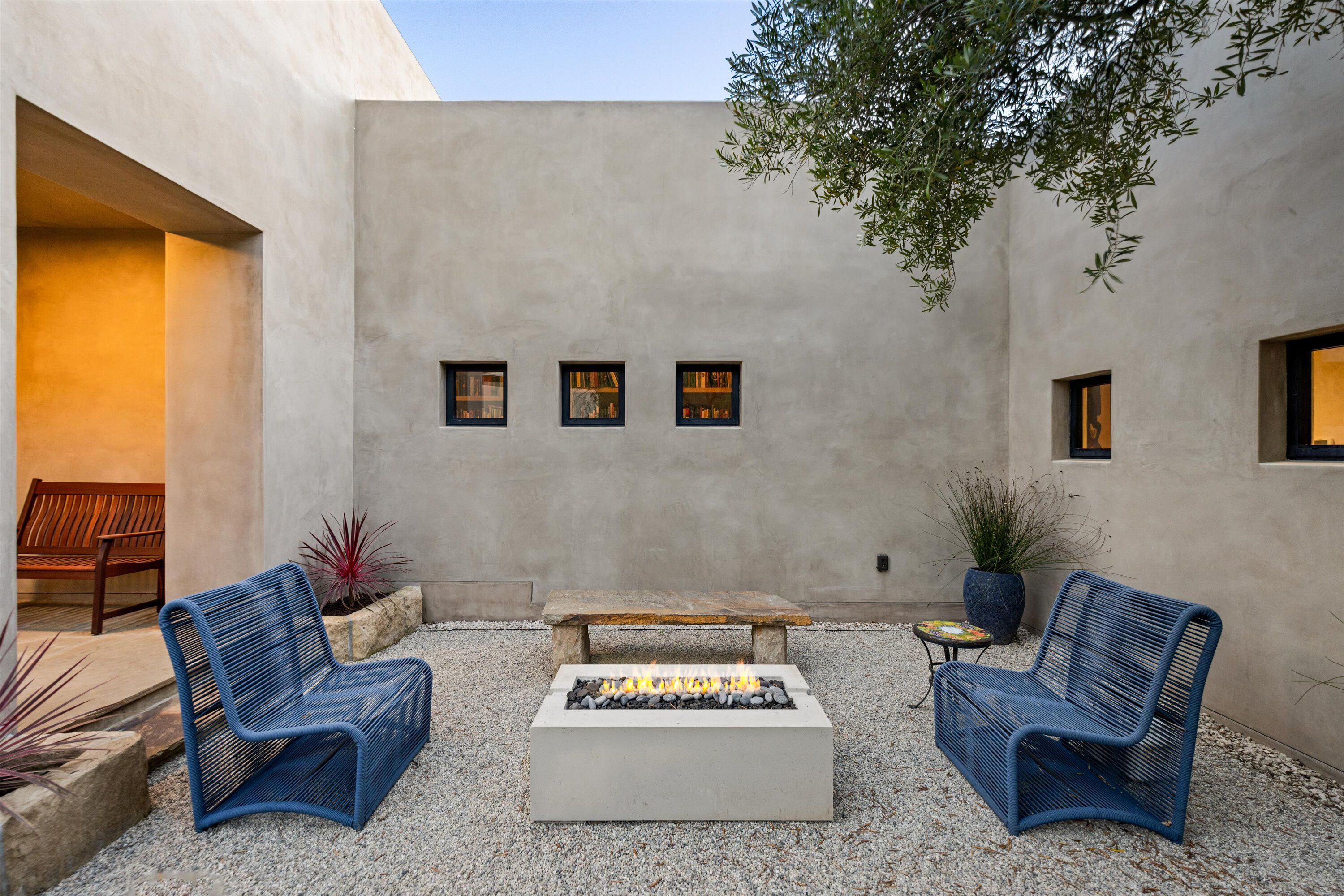 892 Toro Canyon Road Montecito, CA 93108 - Photo 28 of 40 a living room with furniture and a potted plant