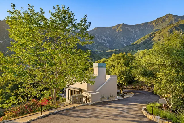 a view of a house with a mountain