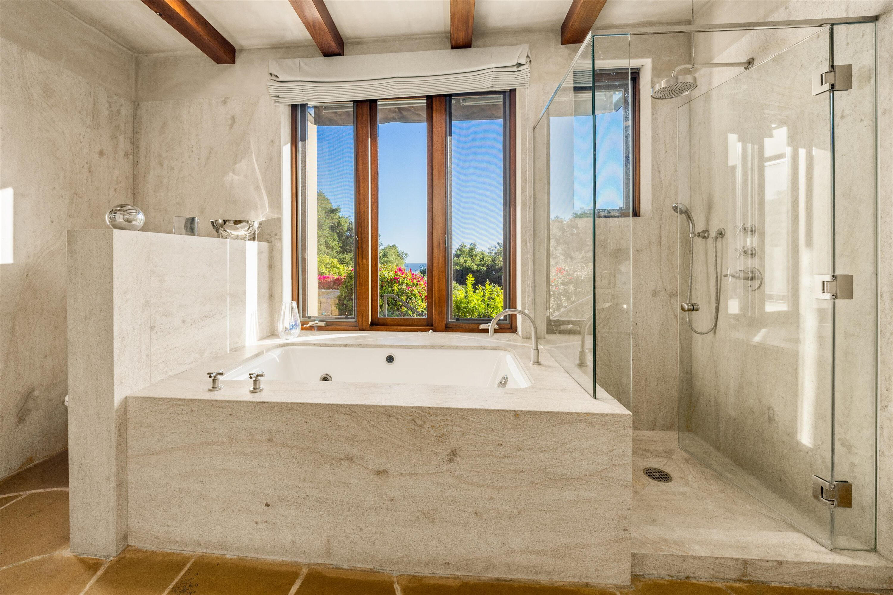 892 Toro Canyon Road Montecito, CA 93108 - Photo 36 of 40 a bathroom with a bathtub and shower