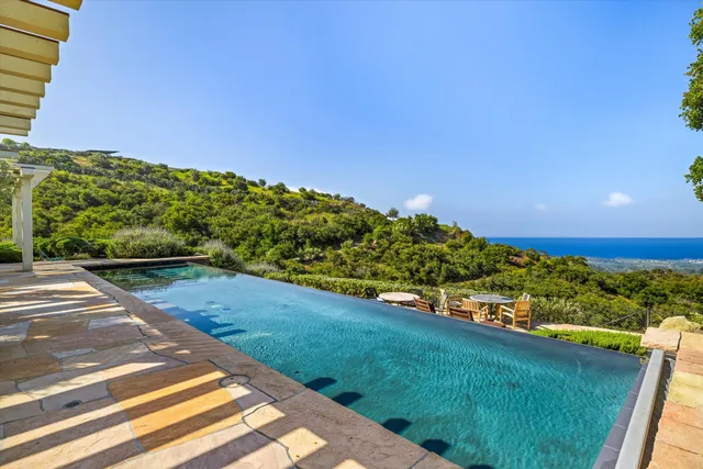 a view of a yard with an ocean view