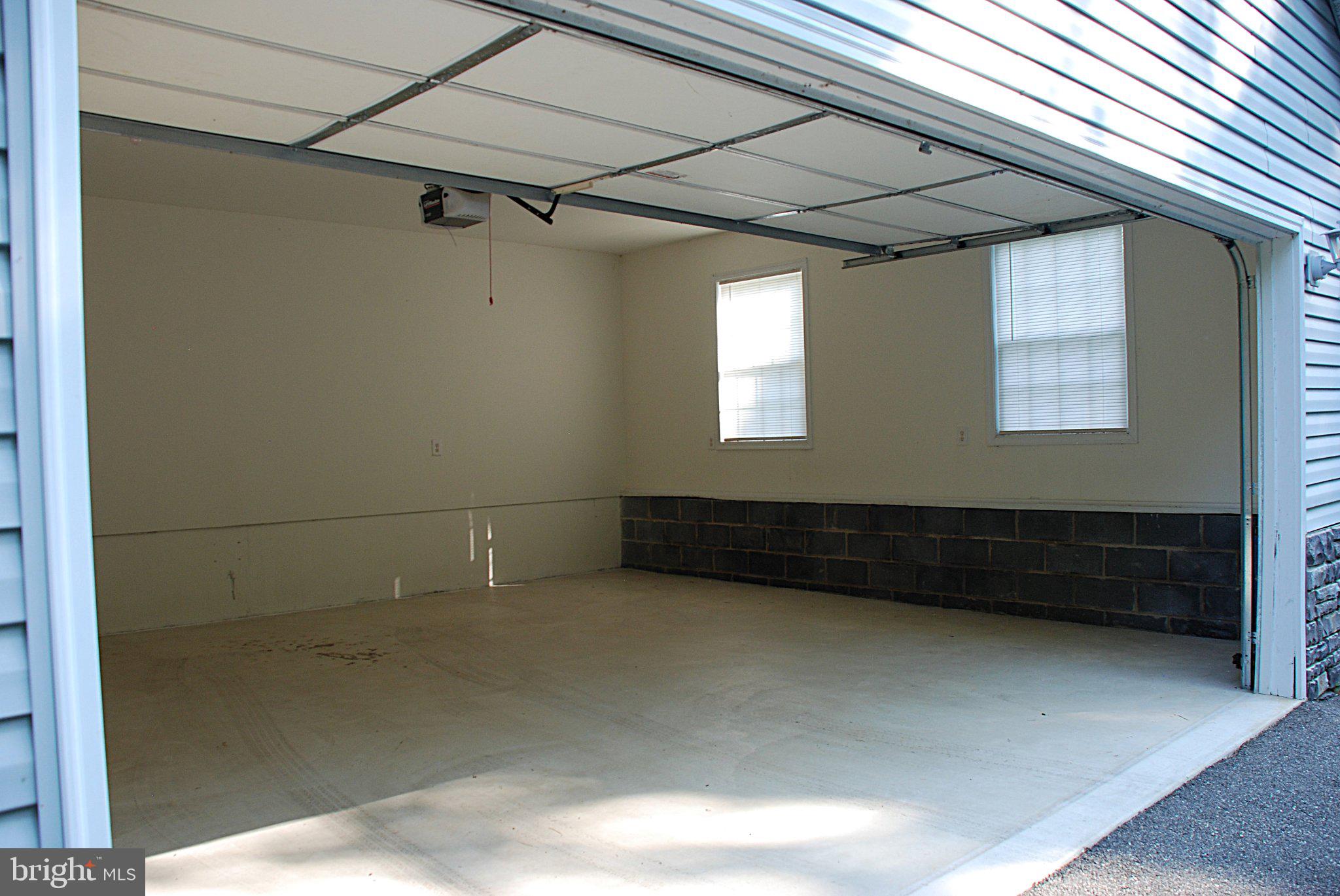 4508 Lewiston Road Bumpass, VA 23024 - Photo 31 of 84 Spacious garage with natural light.