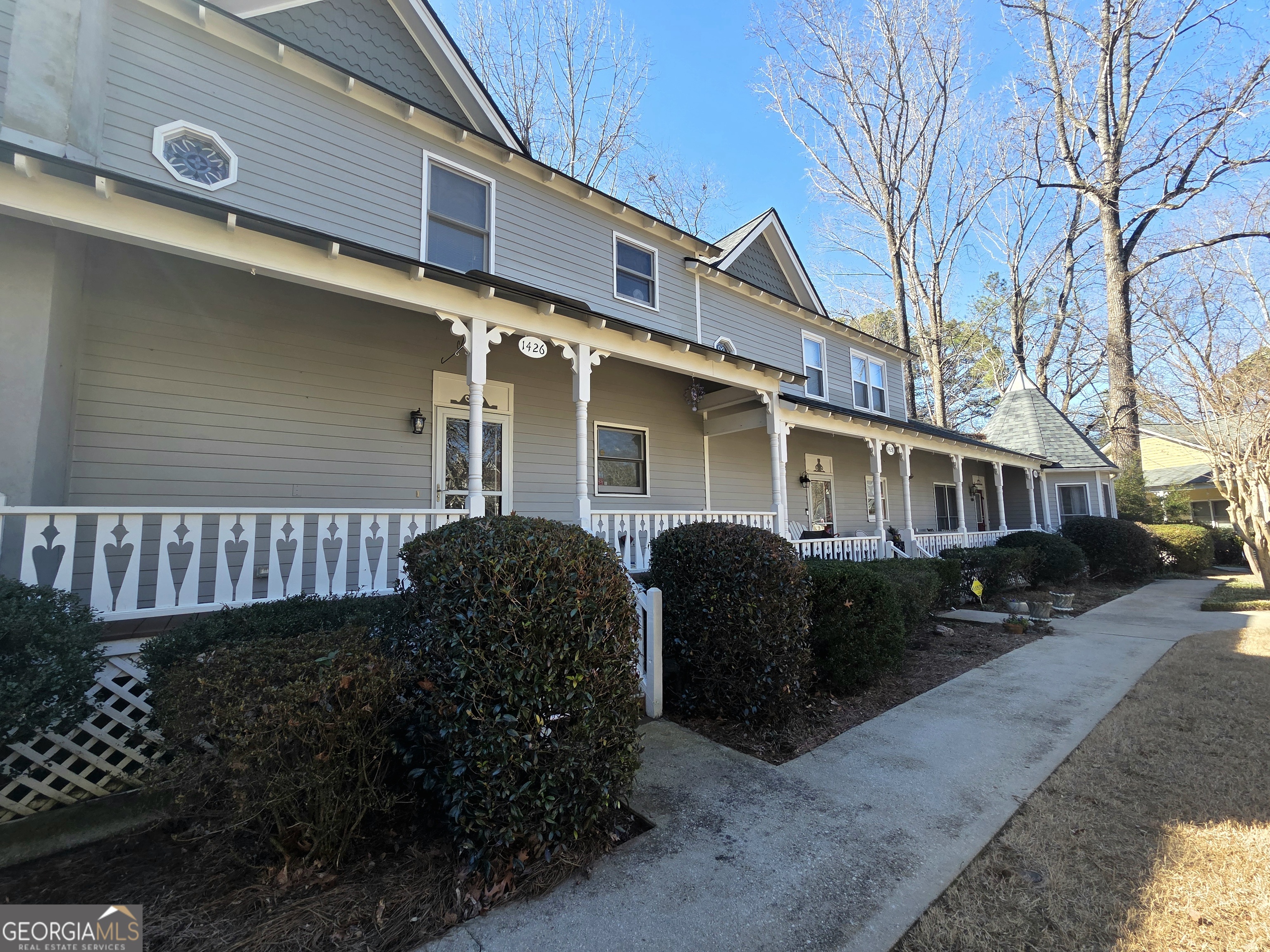 a front view of a house with garden