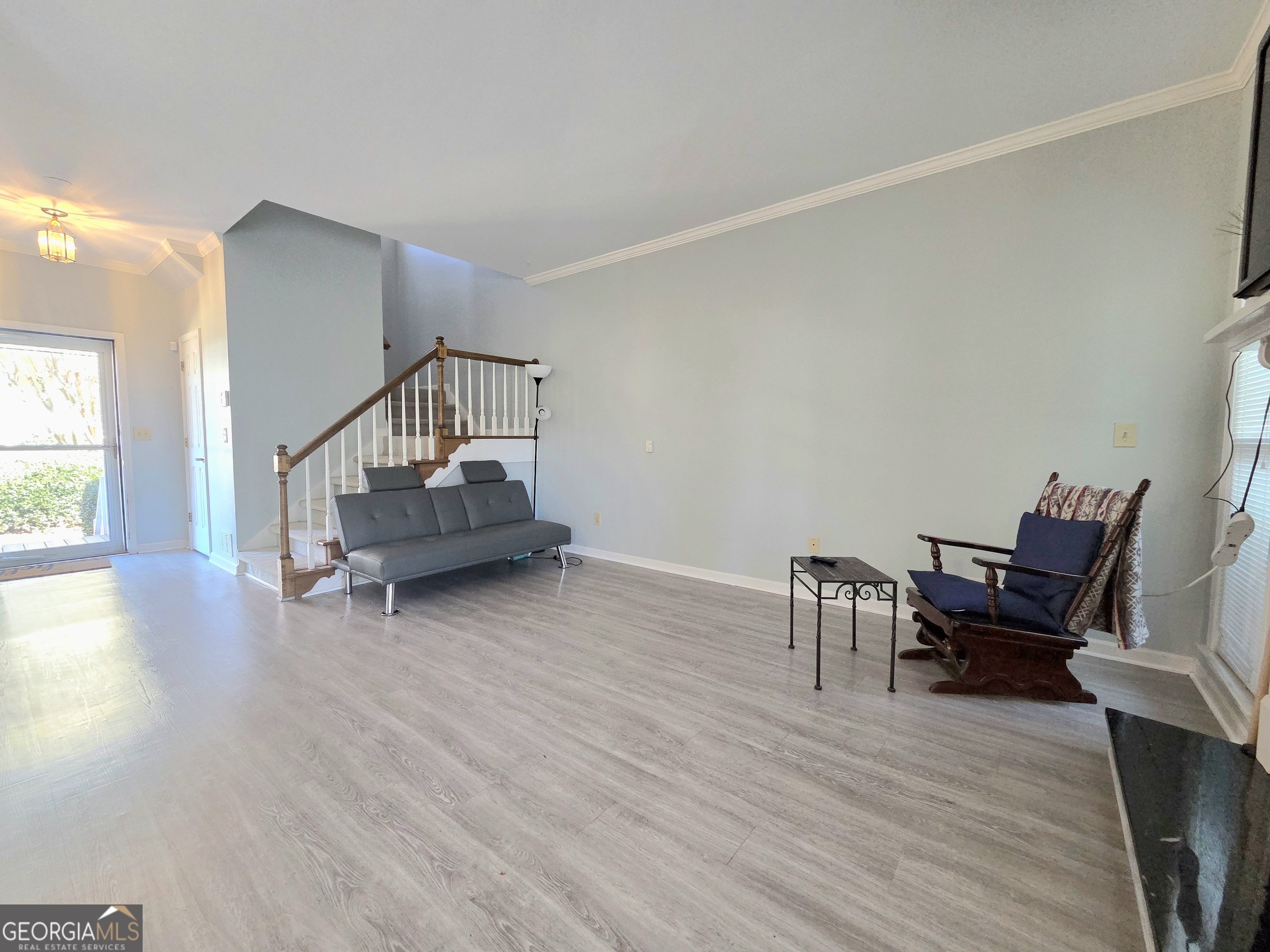 1426 Cambridge Common Decatur, GA 30033 - Photo 15 of 51 a living room with furniture and a wooden floor