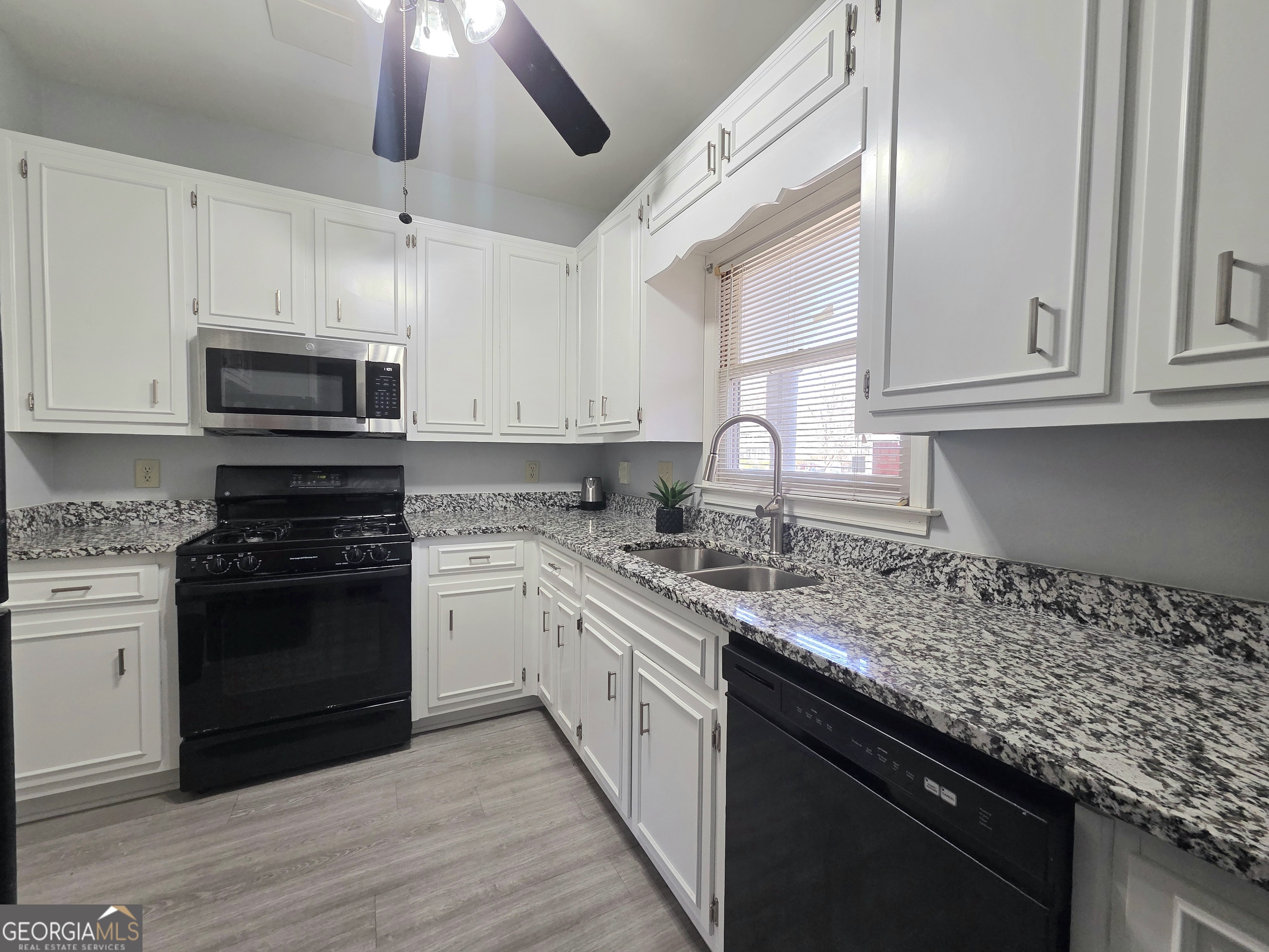 1426 Cambridge Common Decatur, GA 30033 - Photo 18 of 51 a kitchen with granite countertop cabinets stainless steel appliances and a counter space