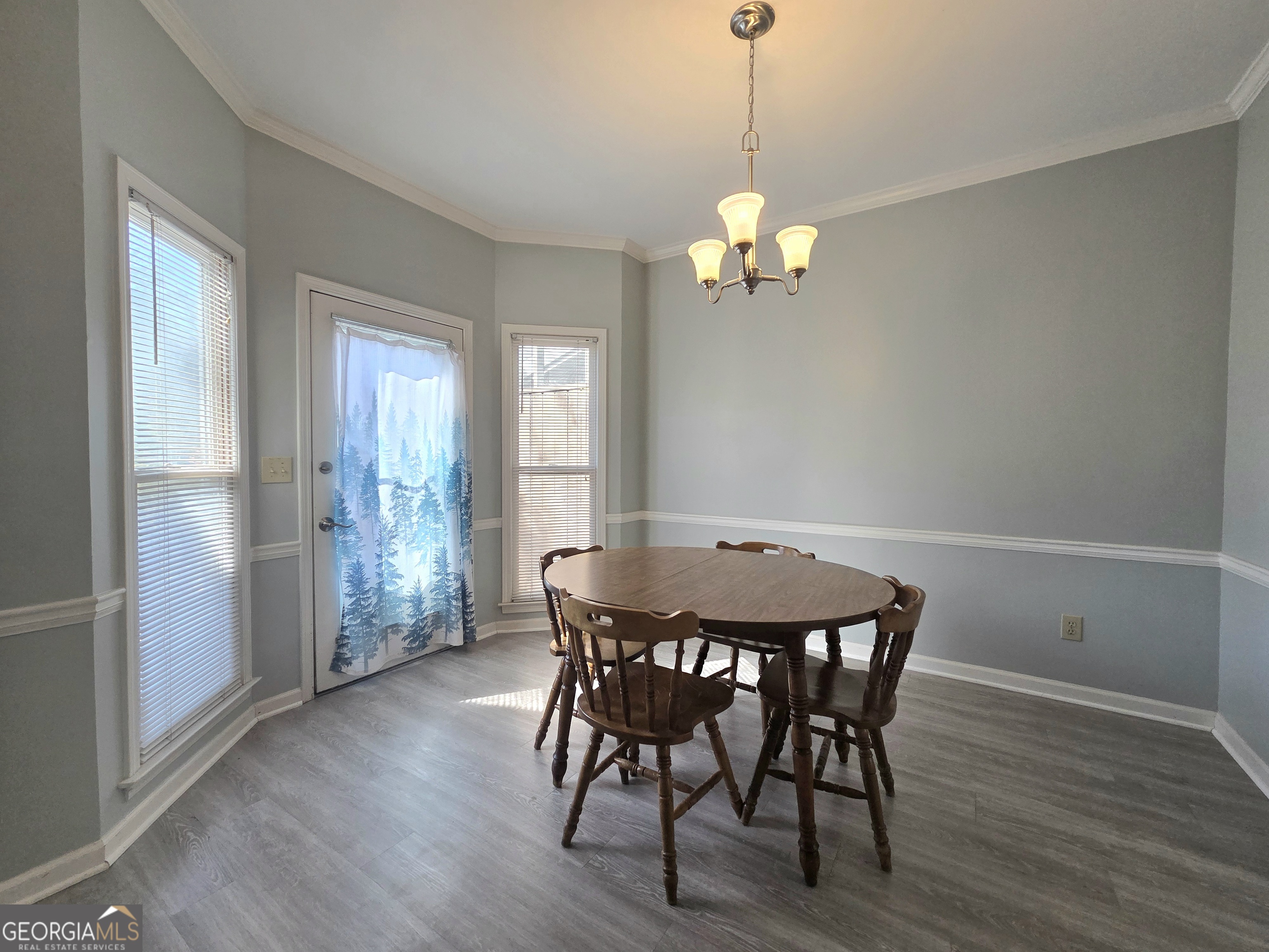 1426 Cambridge Common Decatur, GA 30033 - Photo 22 of 51 a view of a dining room with furniture wooden floor and chandelier