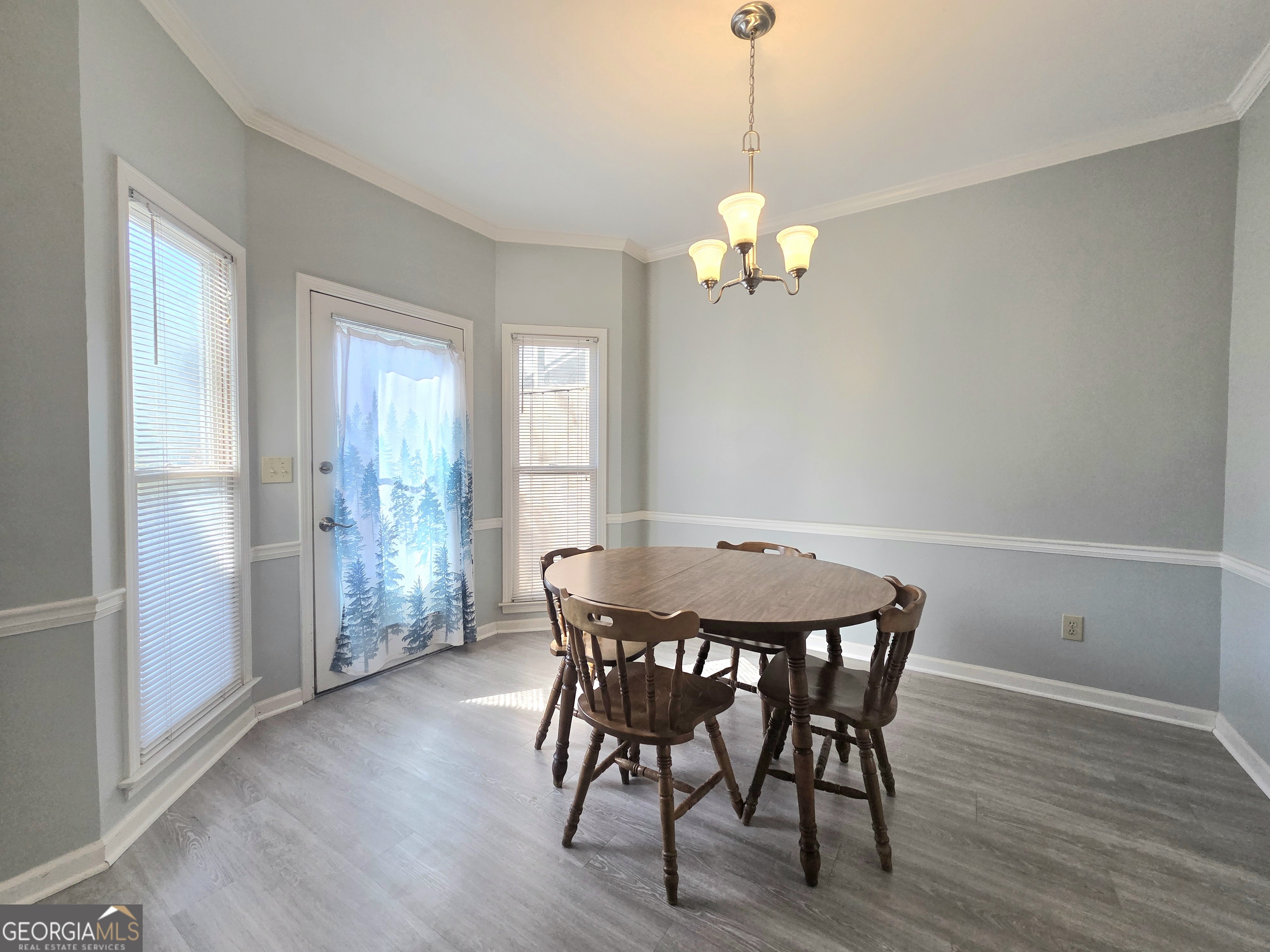 1426 Cambridge Common Decatur, GA 30033 - Photo 23 of 51 a view of a dining room with furniture wooden floor and a chandelier