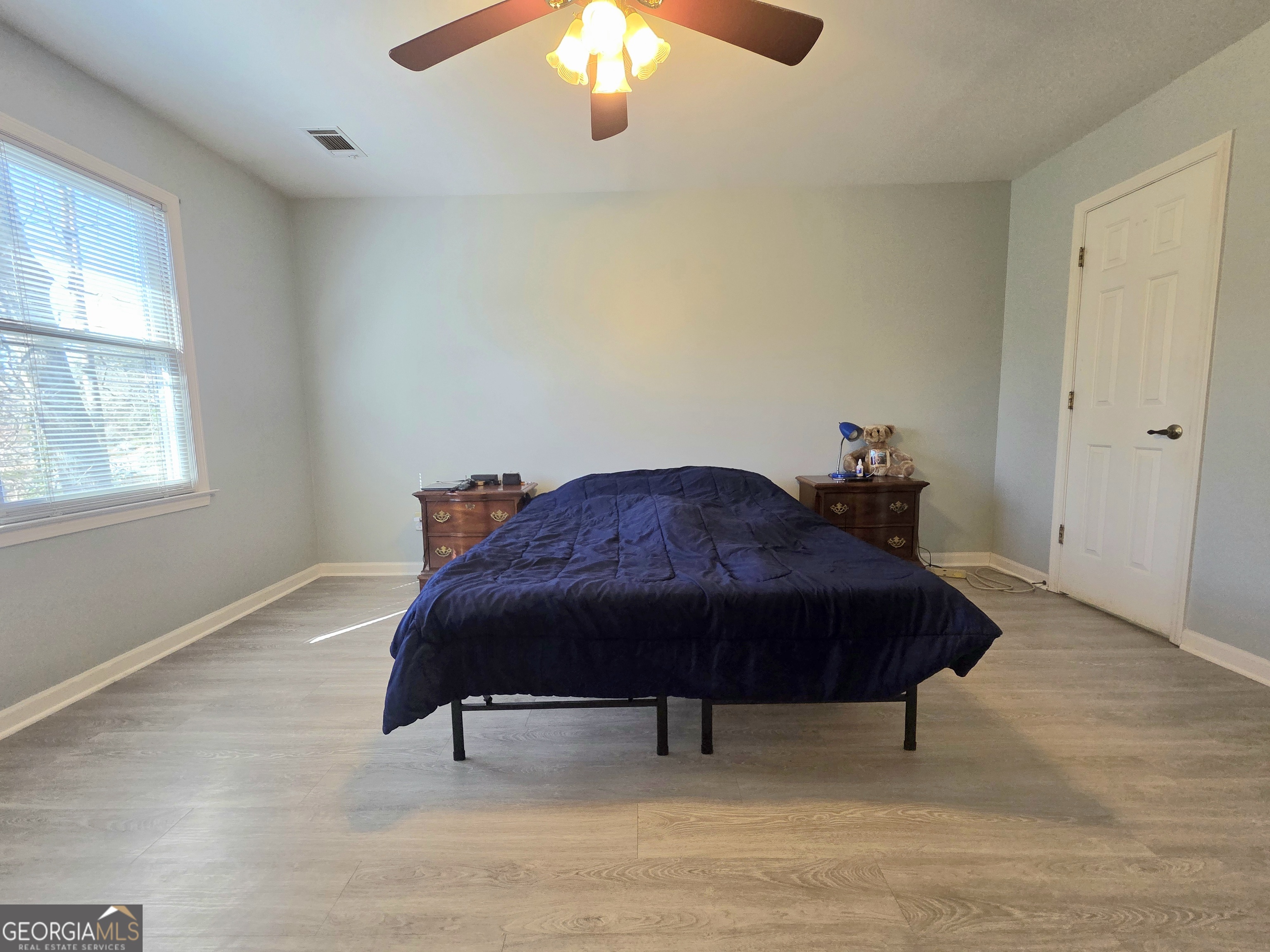 1426 Cambridge Common Decatur, GA 30033 - Photo 26 of 51 a bedroom with a bed and a chandelier