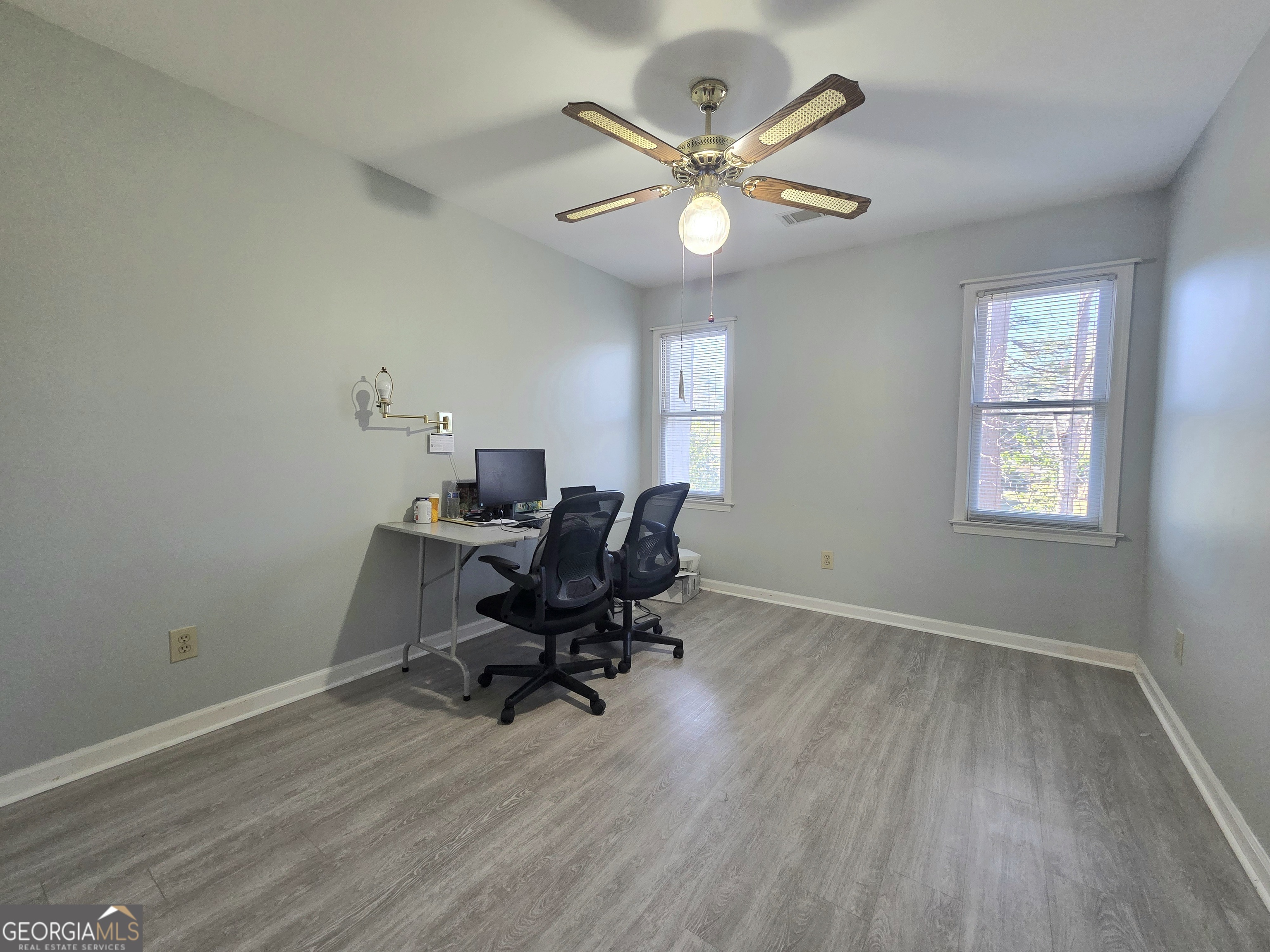 1426 Cambridge Common Decatur, GA 30033 - Photo 28 of 51 a view of a workspace with wooden floor and a window
