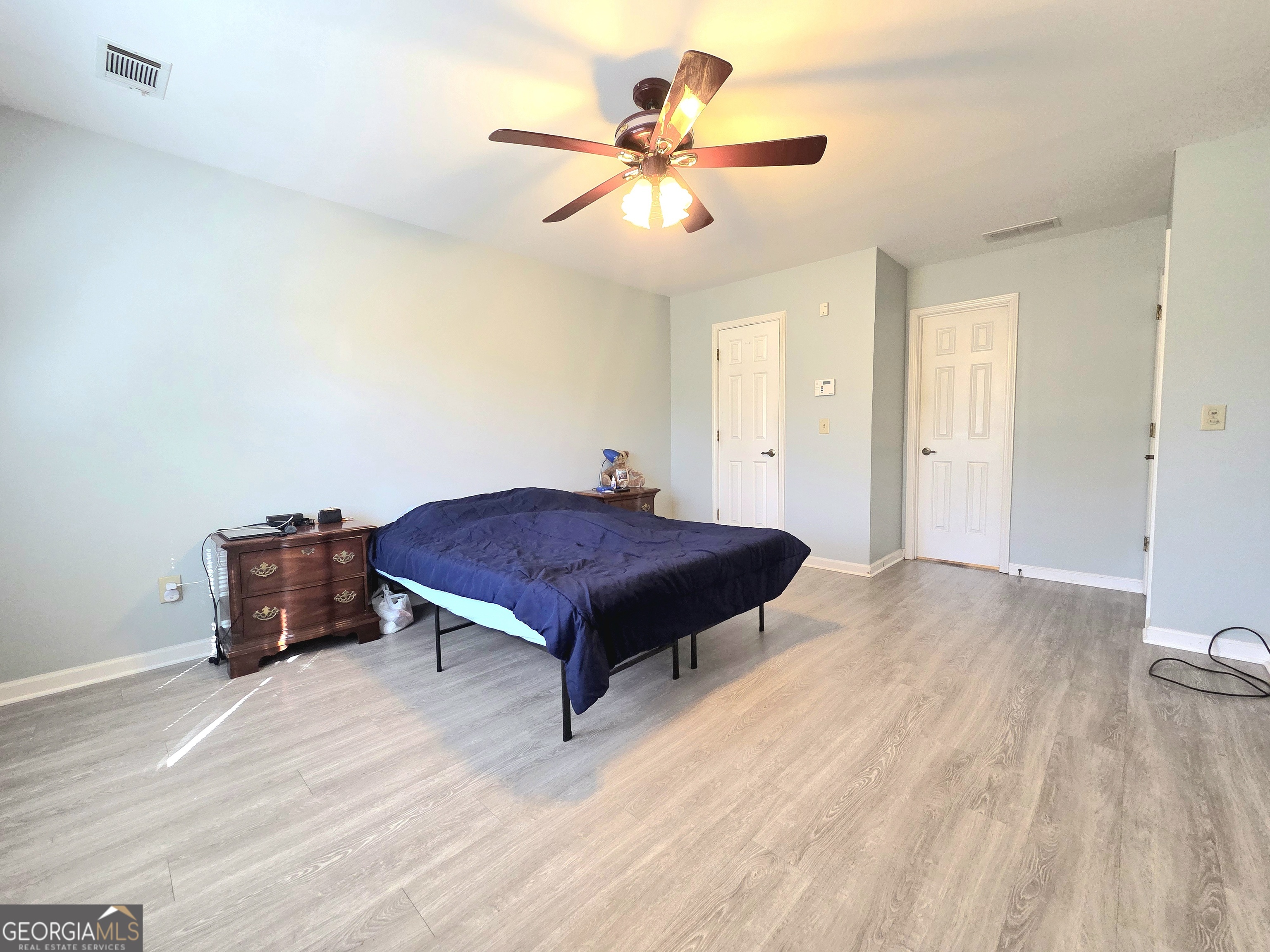 1426 Cambridge Common Decatur, GA 30033 - Photo 33 of 51 a bedroom with a bed and a ceiling fan
