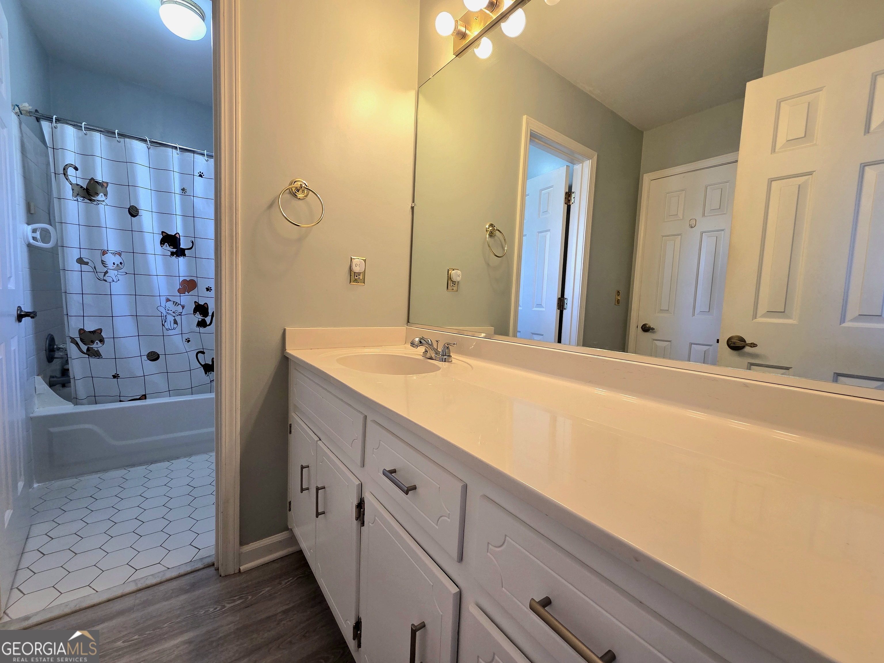 1426 Cambridge Common Decatur, GA 30033 - Photo 36 of 51 a bathroom with a double vanity sink a large mirror and shower