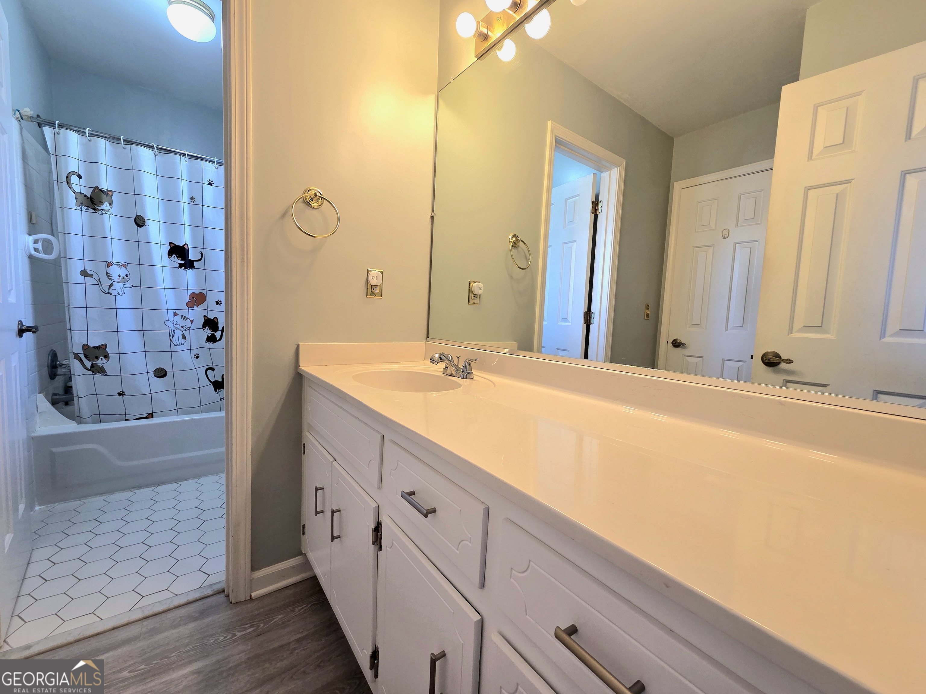 1426 Cambridge Common Decatur, GA 30033 - Photo 37 of 51 a bathroom with a double vanity sink a large mirror and shower