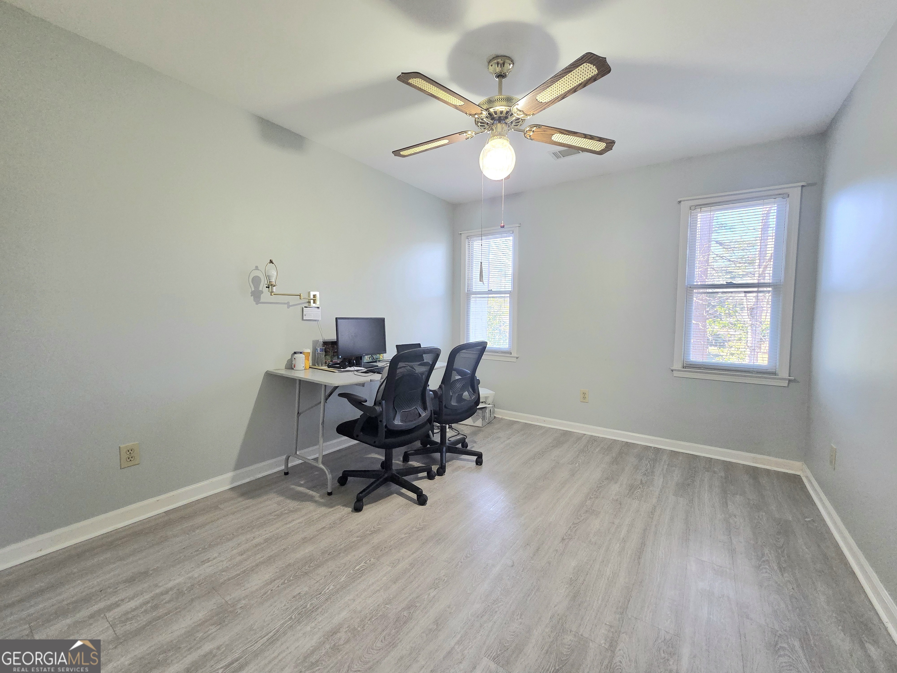 1426 Cambridge Common Decatur, GA 30033 - Photo 39 of 51 a view of a workspace with wooden floor and a window