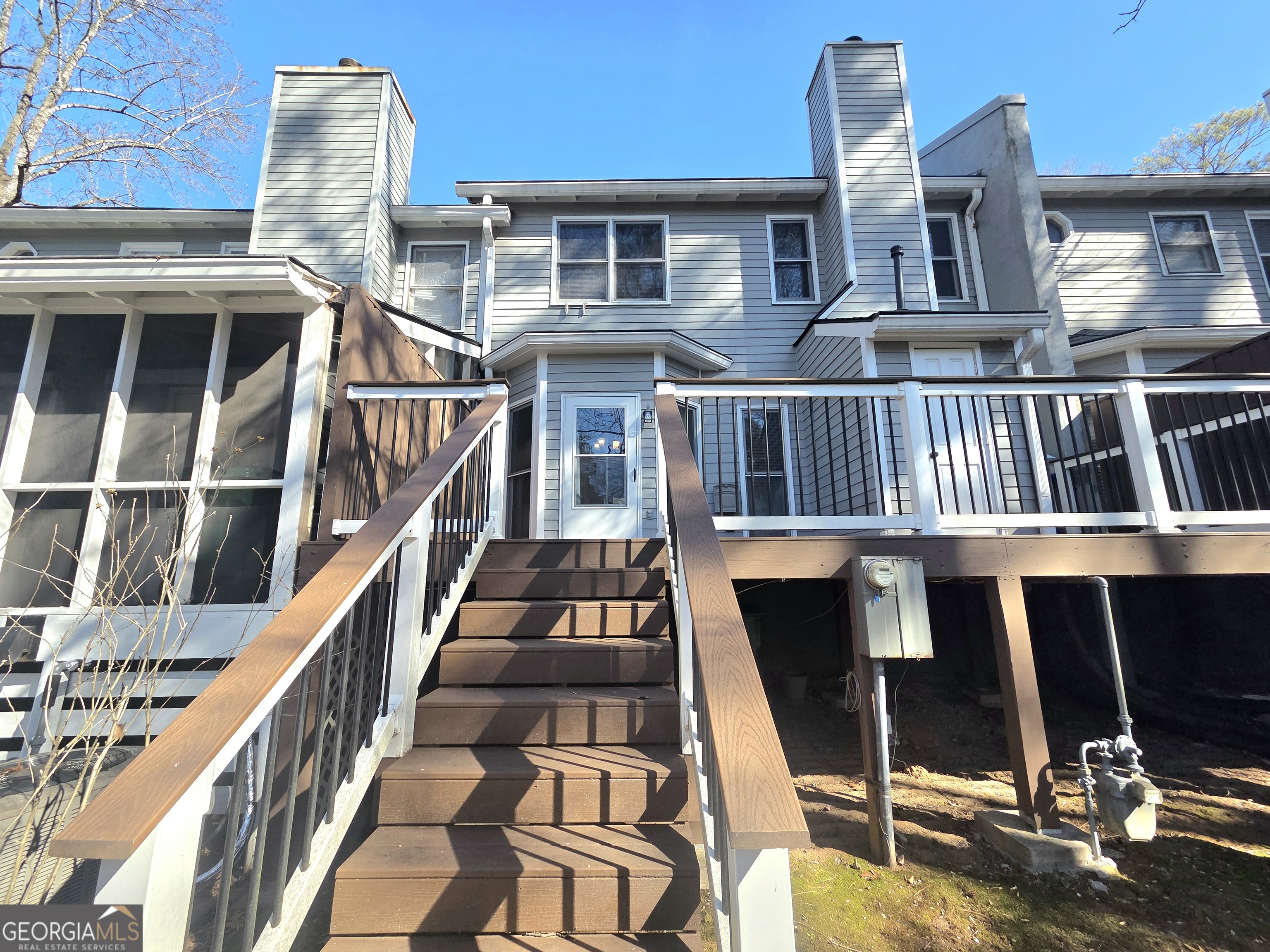 1426 Cambridge Common Decatur, GA 30033 - Photo 49 of 51 a view of a balcony with chairs and wooden floor