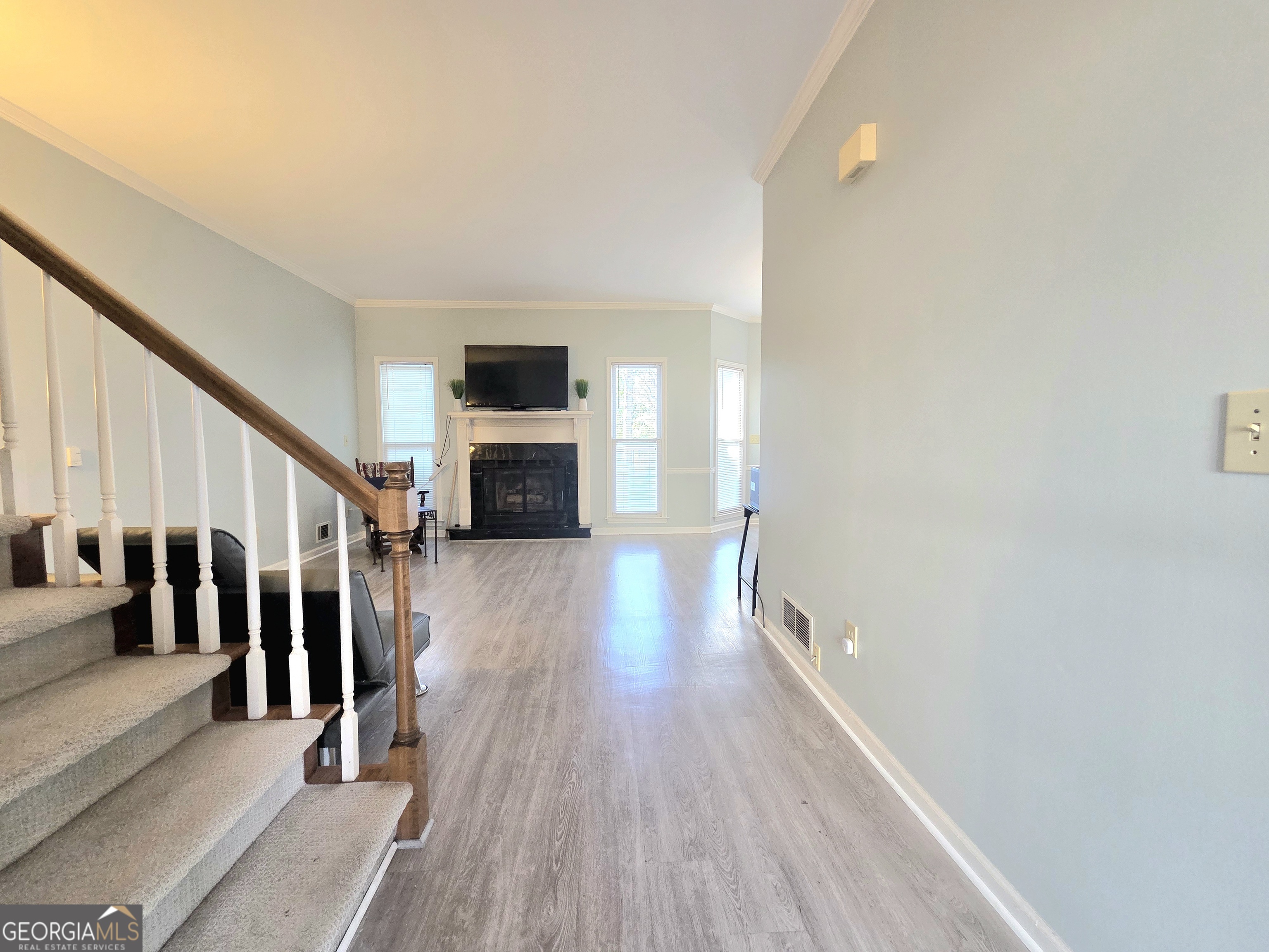 1426 Cambridge Common Decatur, GA 30033 - Photo 7 of 51 a view of a hallway with wooden floor and staircase