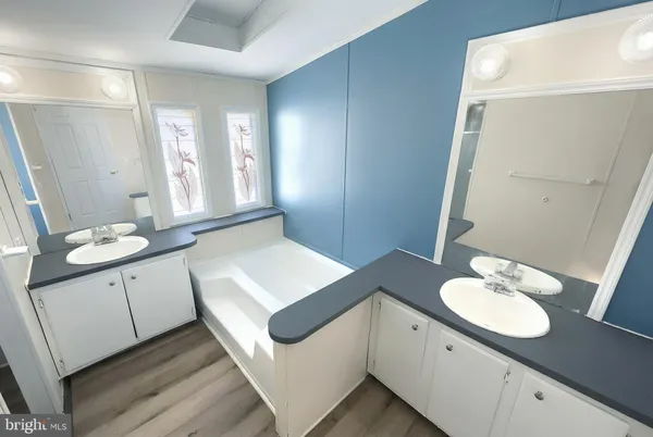 a bathroom with a glass door shower and a toilet