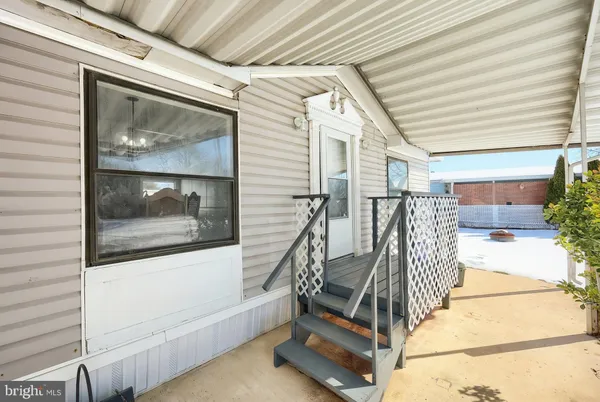 a view of entryway with wooden floor and door