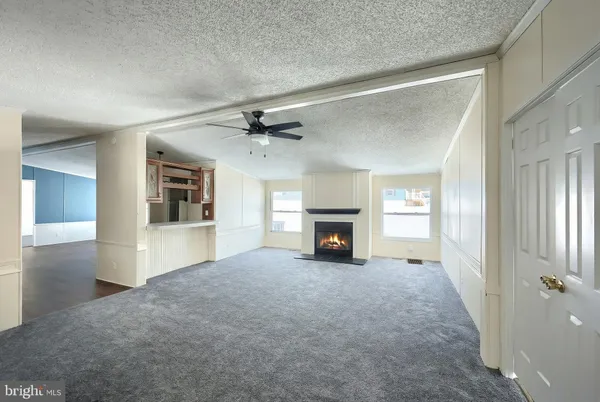 a view of a room with a fireplace