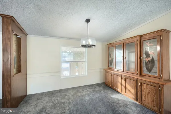 a view of a kitchen from the hallway