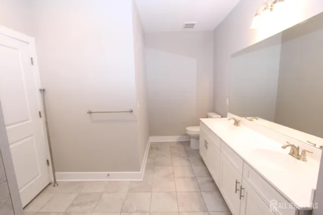 a bathroom with a sink a mirror and a bathtub