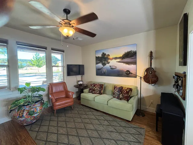 a kitchen with granite countertop a sink and cabinets