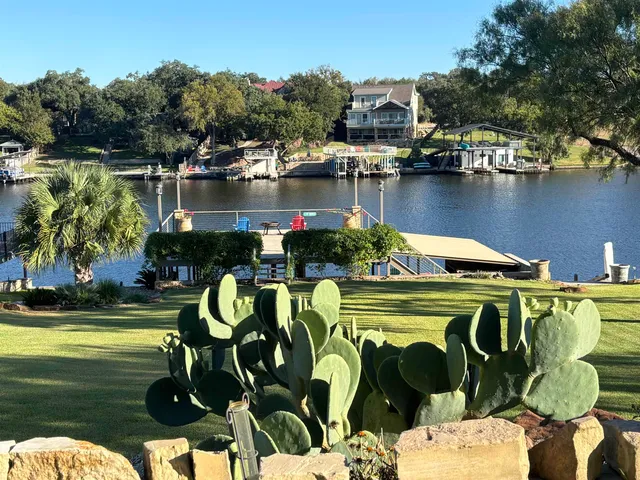 a large bathroom with a granite countertop sink and a large mirror
