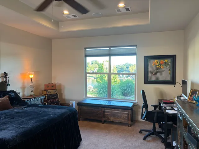 a bathroom with a bathtub and a window