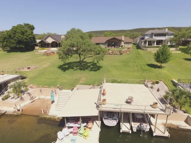 an aerial view of a house with a ocean view